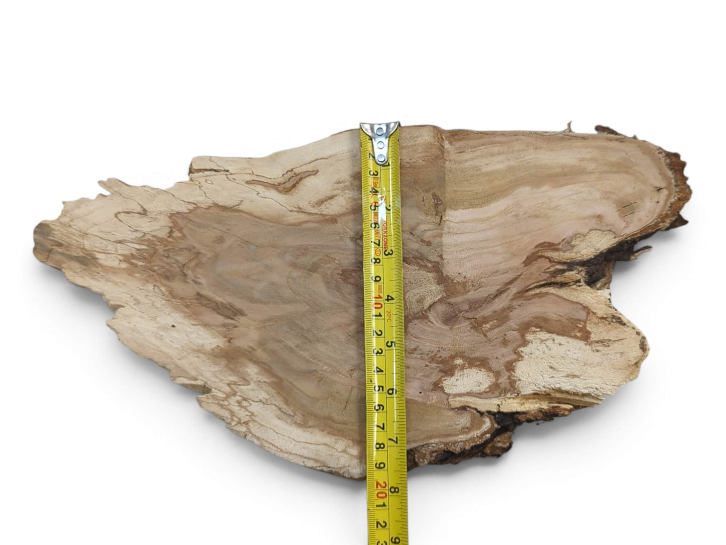 A light brown, irregularly shaped wild cherry wood slab with a live edge and visible grain.