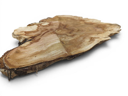 A light brown, irregularly shaped wild cherry wood slab with visible grain on a white background.