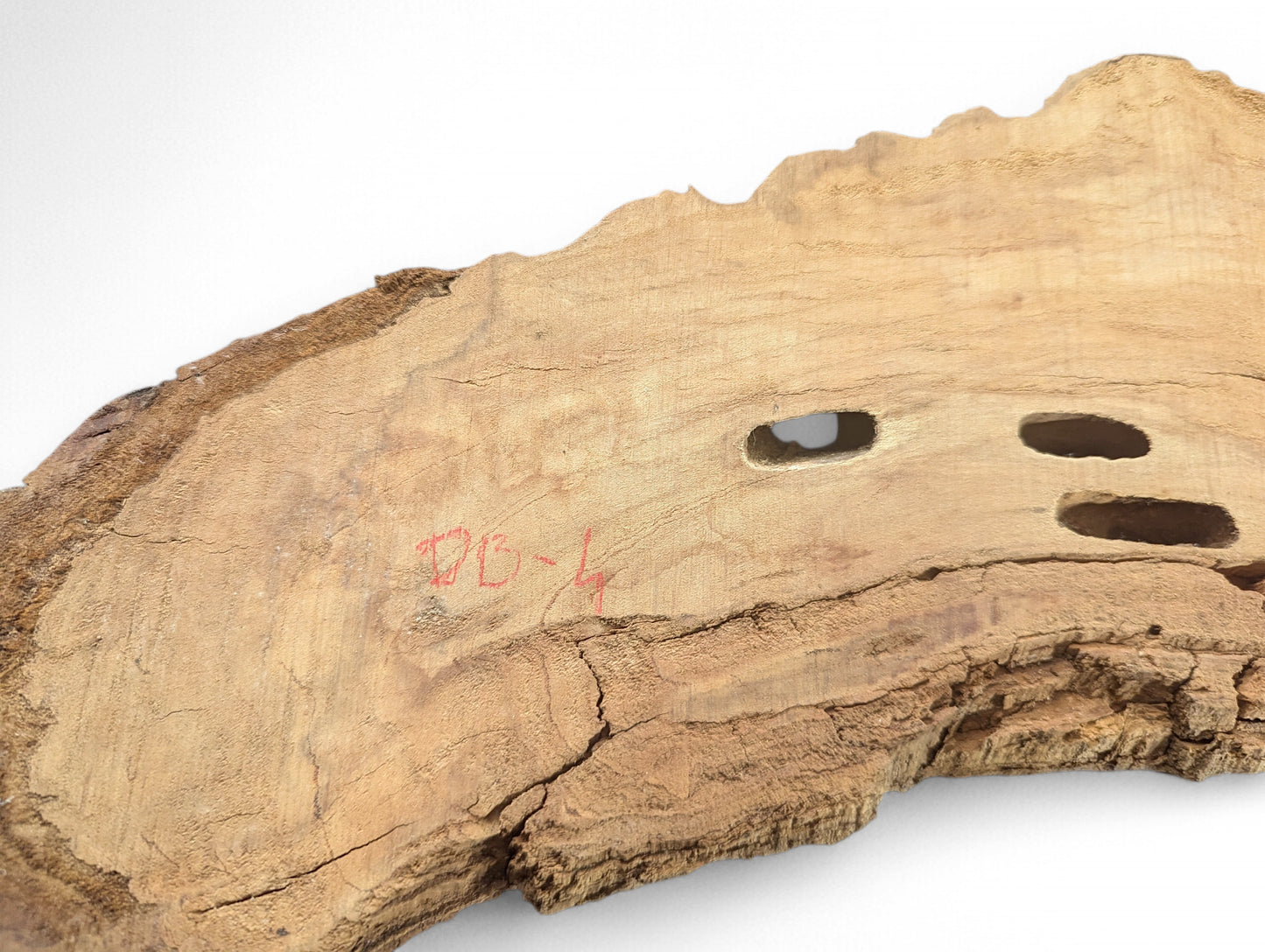 Light brown, untreated wood blank with rough texture, deep cracks, three holes, and red 'DB-4' mark.