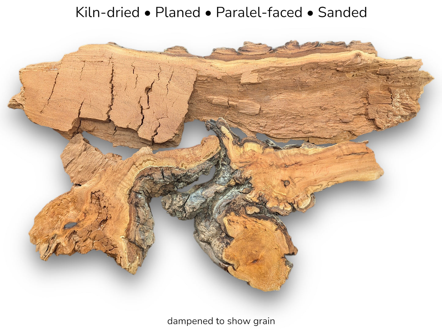 A long, cracked timber slab contrasts two dampened, gnarled burls with swirling golden grain.
