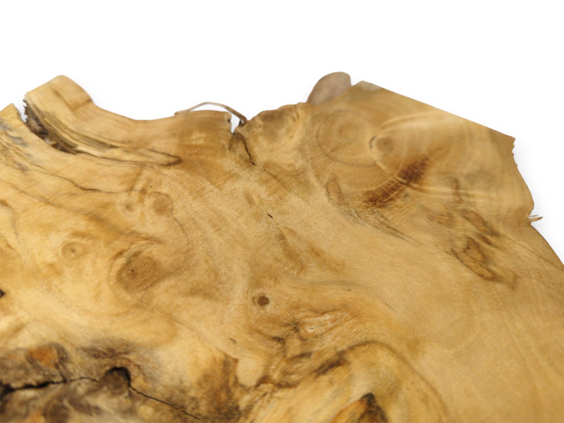 Dark, meandering grain patterns cross a golden timber surface with a rough, splintered live edge.