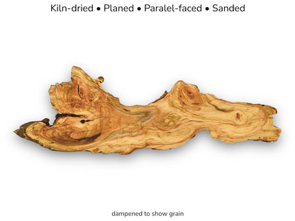 A long, serpentine timber piece shows off its vibrant, flowing grain and swirling knots.