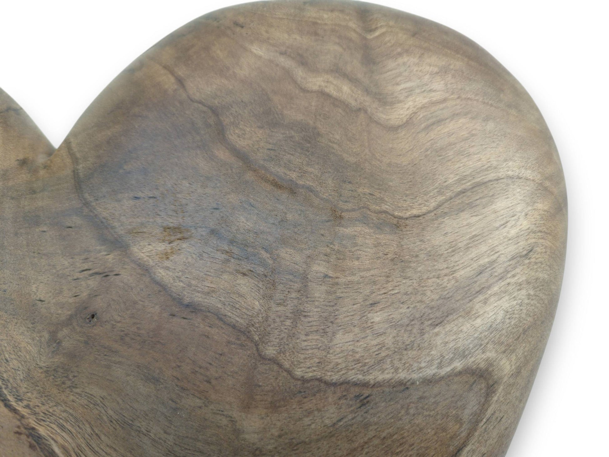 Broad, undulating bands of dark and light grain flow across a smoothly oiled heartwood carving.