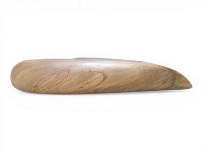 Fine, dark lines of grain follow the thick, rounded profile of a carved timber heart.