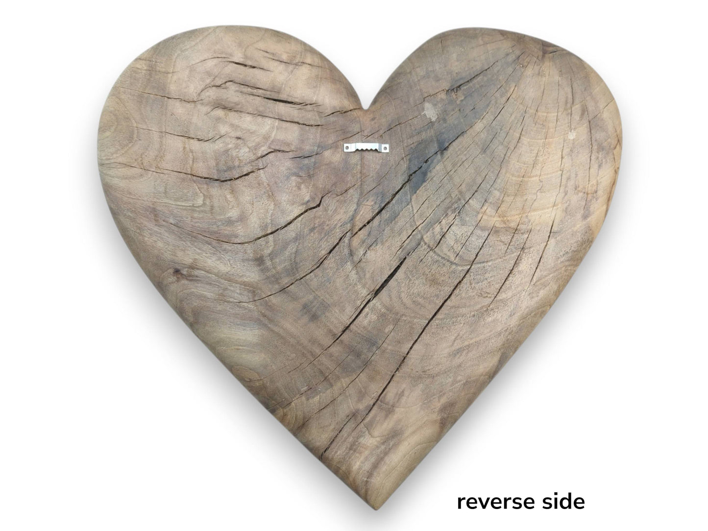 The deeply cracked reverse side of a rustic timber heart features a metal sawtooth hanger.
