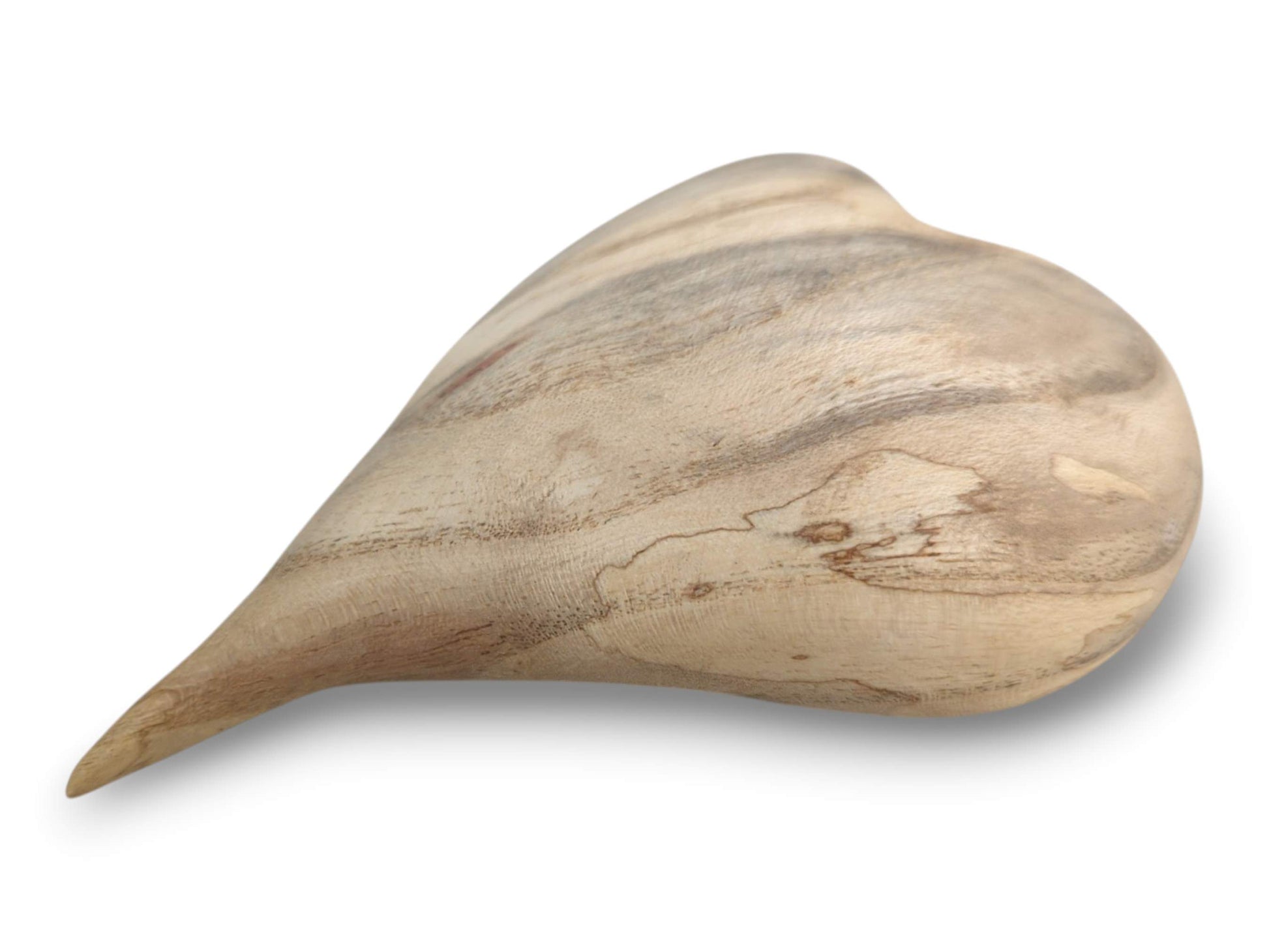 Viewed from the side, a carved lumber heart shows horizontal grain and a sharp, extended tip.