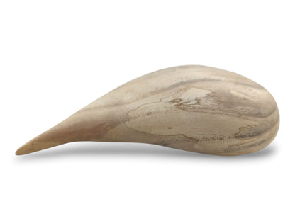 A sculpted timber heart on its side reveals a teardrop shape and smoky, marbled grain.