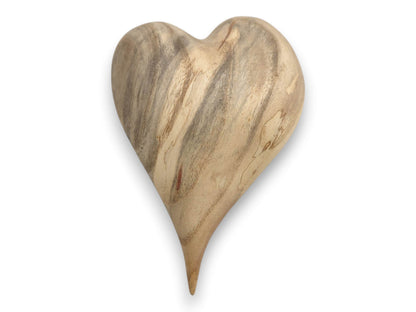 Broad, smoky gray streaks flow vertically down a pale timber heart with a single sharp point.