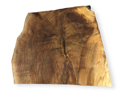 Irregularly shaped live edge wood slice displays intricate swirling grain patterns in diverse shades of brown.