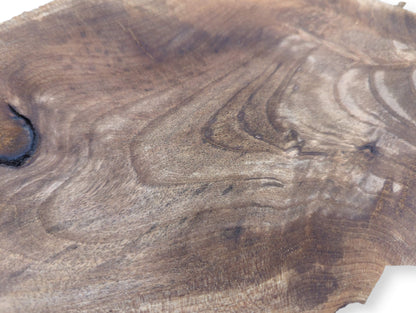 Irregular brown English walnut wood slice featuring prominent dark wavy grain, a knot, and surface variations.