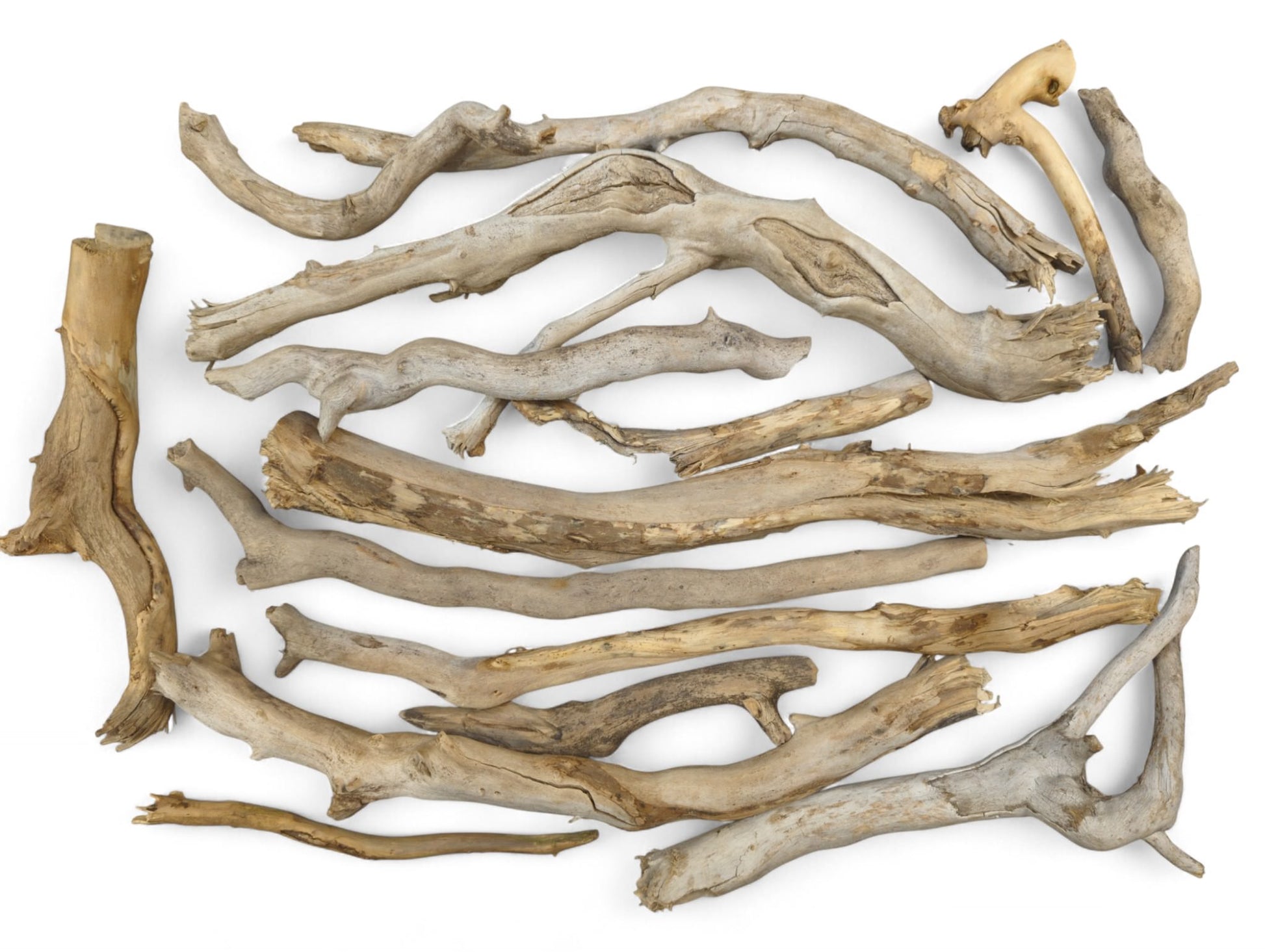 Assortment of weathered natural driftwood pieces, light to dark brown and gray, with varied smooth and rough textures.