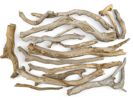 Assortment of weathered natural driftwood pieces, light to dark brown and gray, with varied smooth and rough textures.