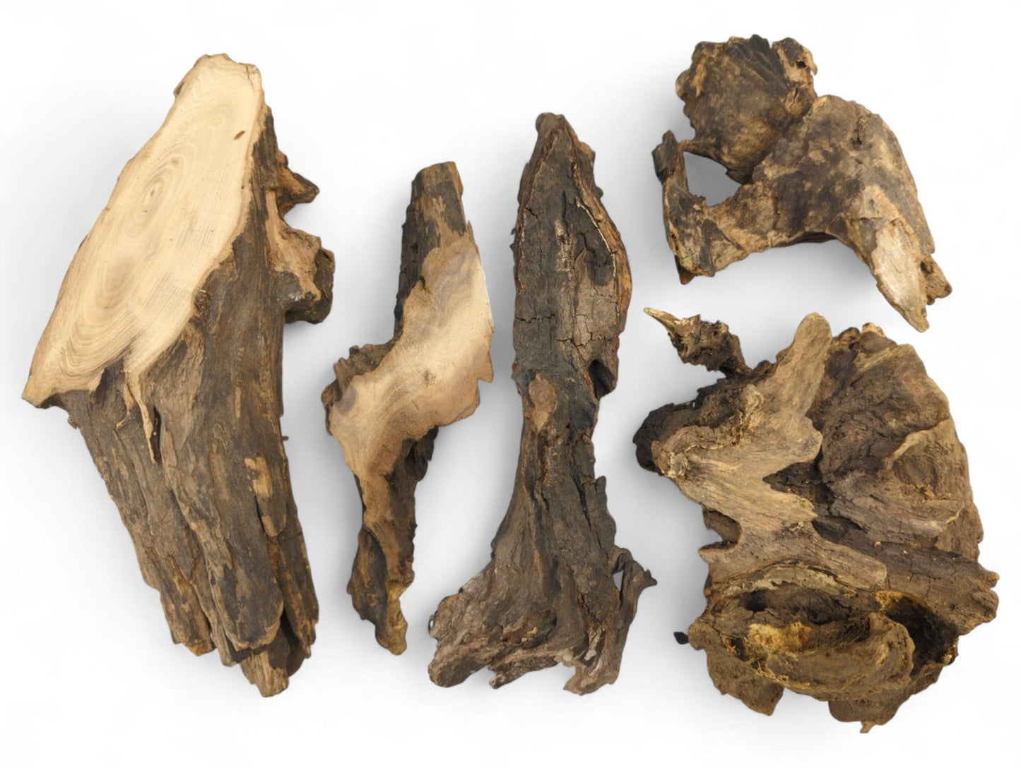 Five irregularly shaped pieces of aged, dark brown wood with visible grain and rough textures.