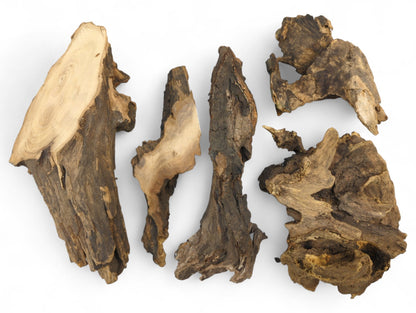 Five irregularly shaped pieces of aged, dark brown wood with visible grain and rough textures.