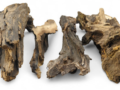 Four gnarled, irregular pieces of dark brown aged wood, featuring rough textures and lighter grain.