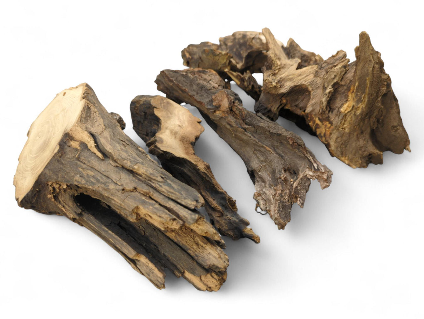 Assorted dark brown wood pieces, gnarled and irregular in shape, displaying rough textures and lighter grain.