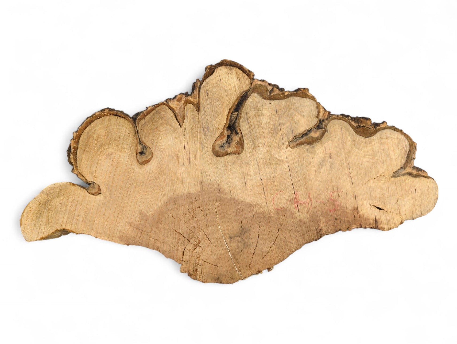 Organic, light brown cherry wood endgrain slab with dark, textured live bark edge and faint red marks.