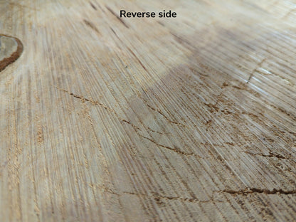 Image with 'Reverse side' text showing light brown cherry wood endgrain, featuring saw marks and cracks.