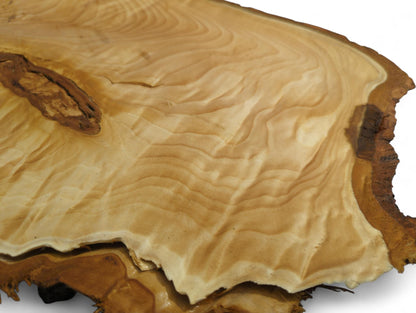Irregularly shaped linden root slice, planed surface, light wood, intricate swirling grain, and dark bark edges.
