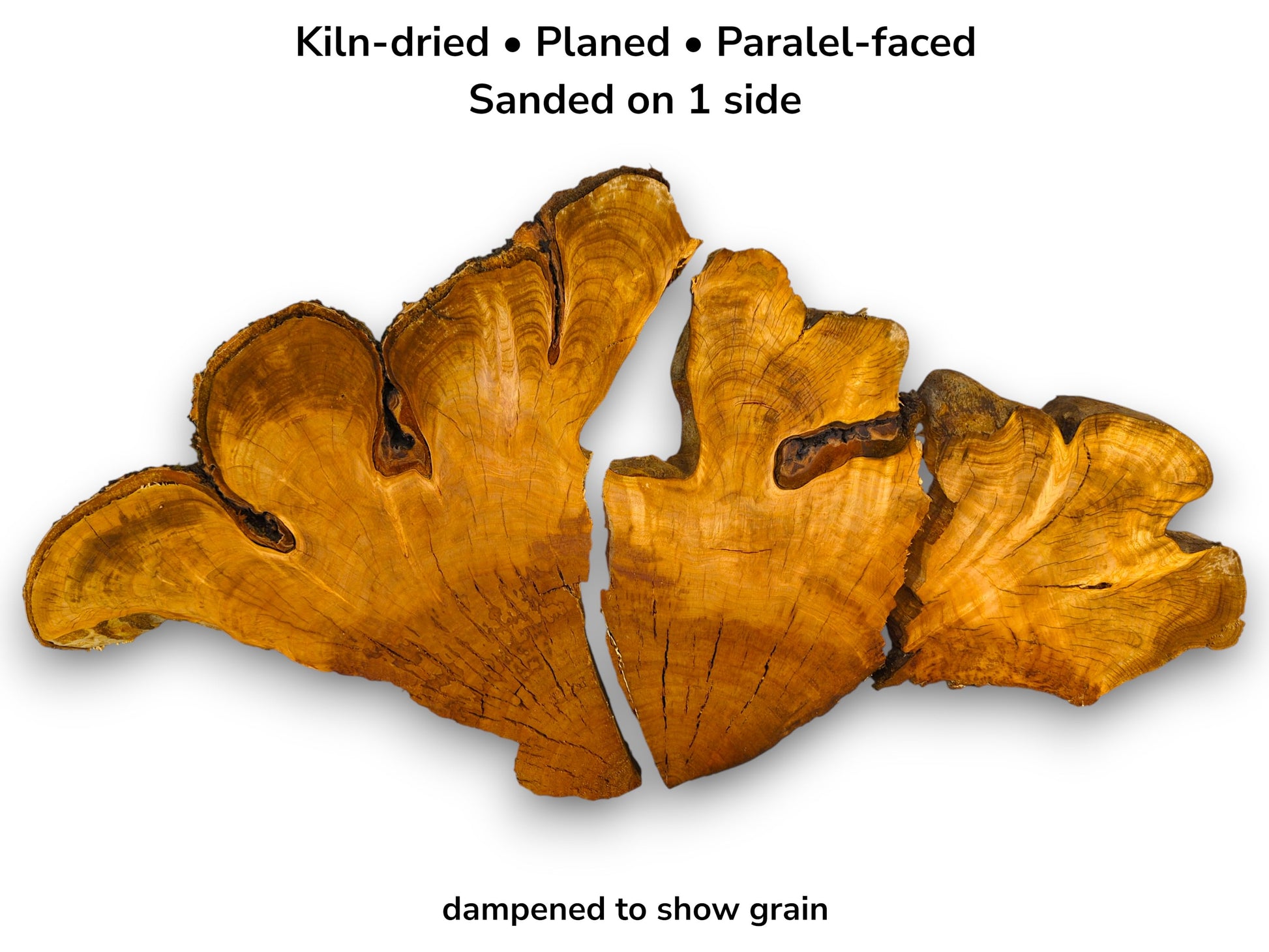 Three split cherry root slabs feature contoured grain, dark inclusions, and a rugged bark edge.