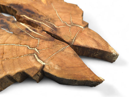 Warm reddish-brown bookmatched cherry wood slices reveal visible grain, golden cracks, and irregular live edges.