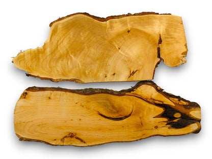 Two irregular, light-colored linden wood slabs displaying natural grain and dark textured bark edges.