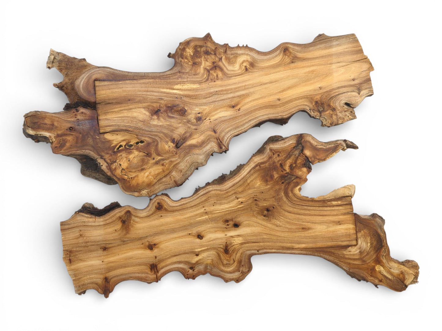 Two organically shaped hardwood slabs arranged parallel, showing the distinct, flowing patterns of their wood grain.
