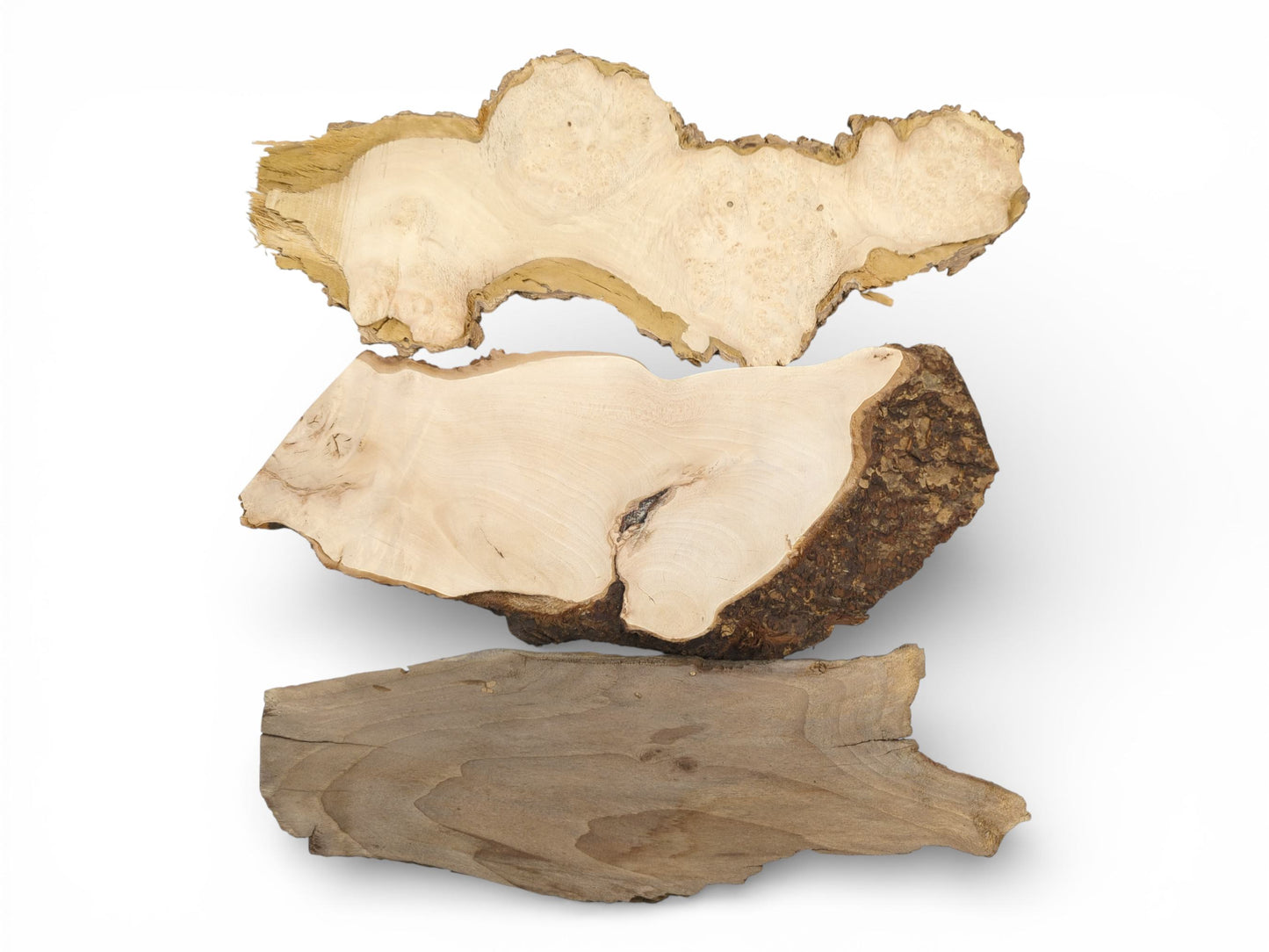 Three wood slabs with natural live edges arranged horizontally to display their unique grain and coloration.