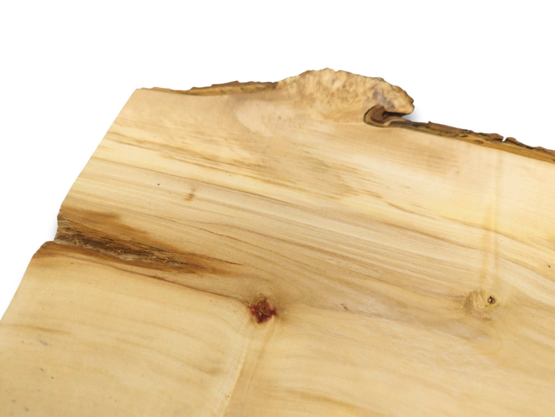 A pale timber plank shows a curled burl on its live edge and a reddish knot.