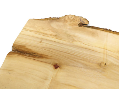A pale timber plank shows a curled burl on its live edge and a reddish knot.