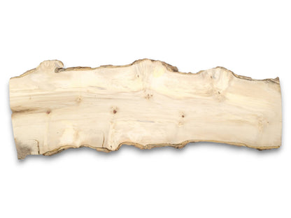 A pale, raw-edged wood plank displays a central reddish knot and subtle, wavy grain.