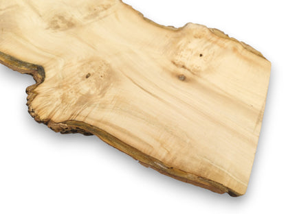A smooth lumber section displays faint grain waves and a dark, gnarled, bark-lined perimeter.