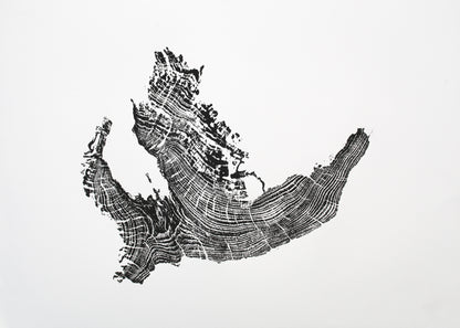 Black and white woodcut monoprint features an irregular tree root impression with distinct, textured concentric growth rings.