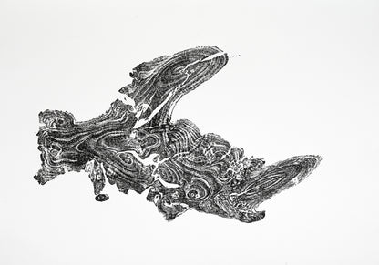 Dark, irregularly shaped tree root impression printed on white paper, showing detailed organic wood grain patterns.