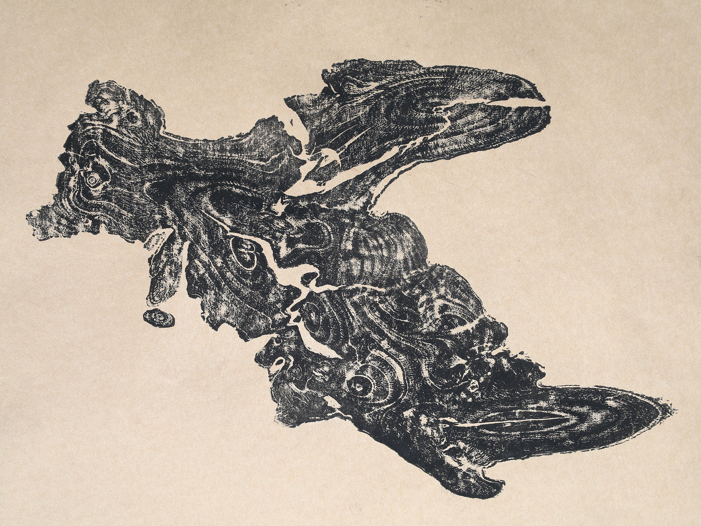 A dark, irregularly shaped tree root impression monoprint with detailed organic grain patterns on light beige paper.