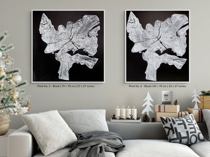 Two framed black and white irregular tree root impressions with wood grain texture and text.