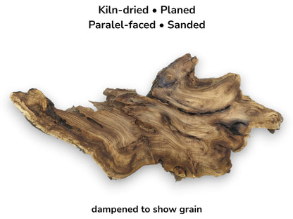 A planed root burl displays undulating grain patterns and a craggy, bark-lined natural edge.
