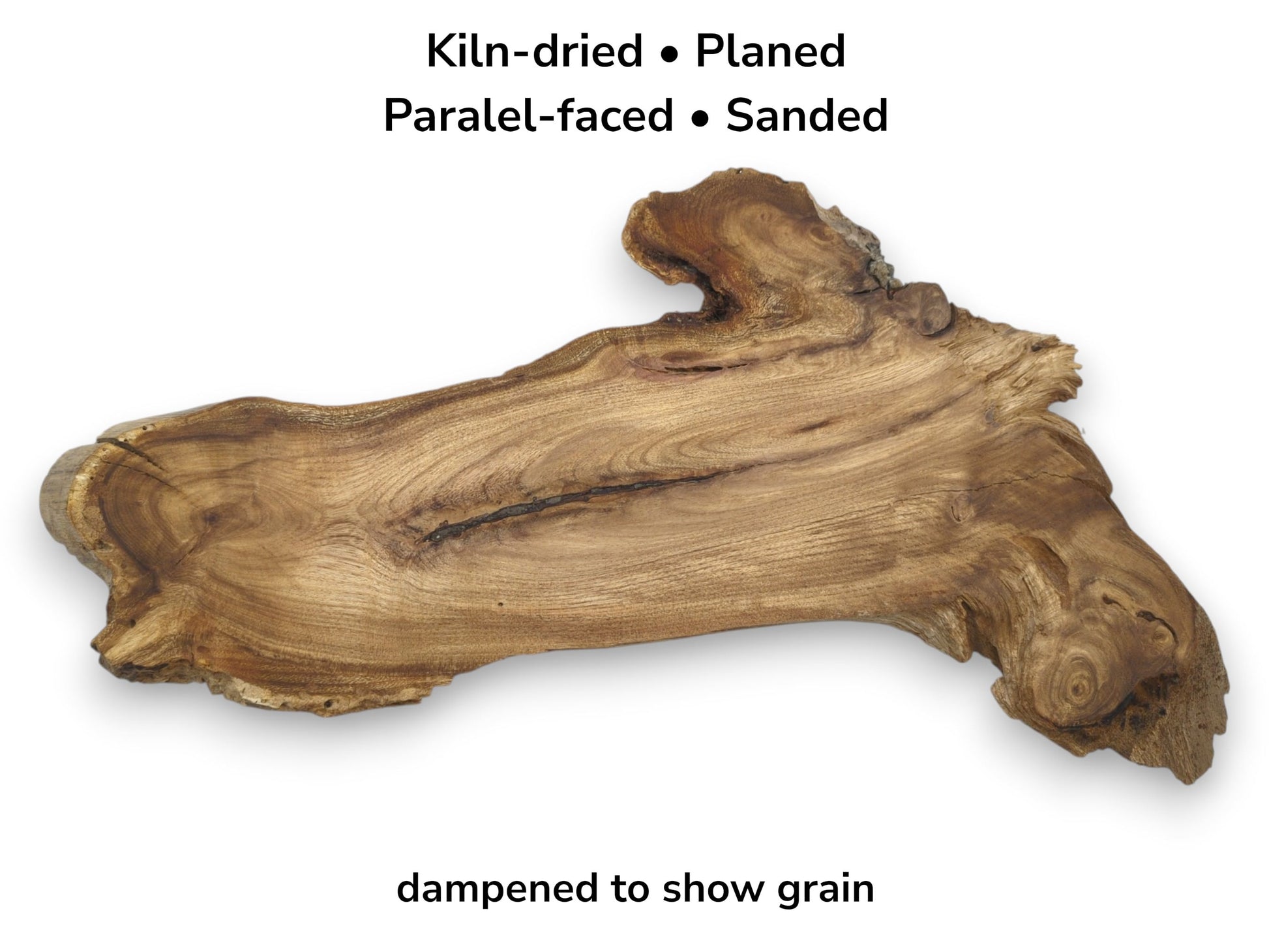 An overhead view of a rustic timber section reveals undulating grain and a dark central fissure.