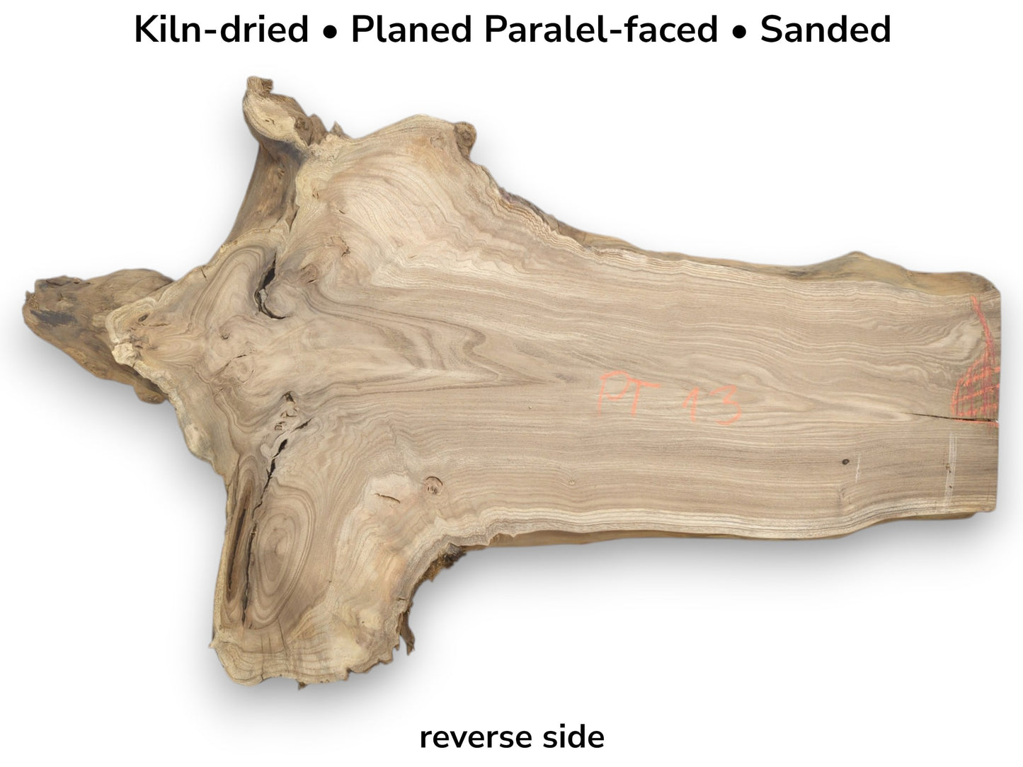 A planed timber section shows contoured grain flowing from a gnarled base to a straight-cut edge.