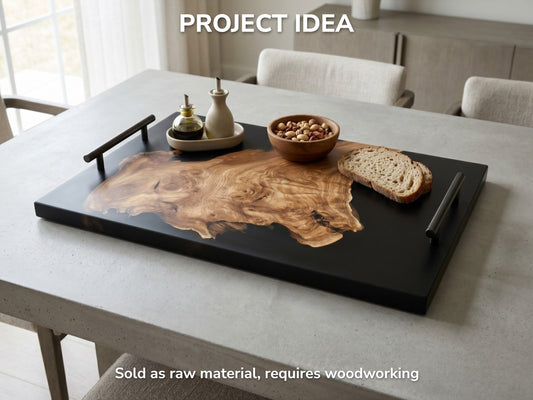 Golden-hued lumber with a winding live edge contrasts sharply within a matte black tray.