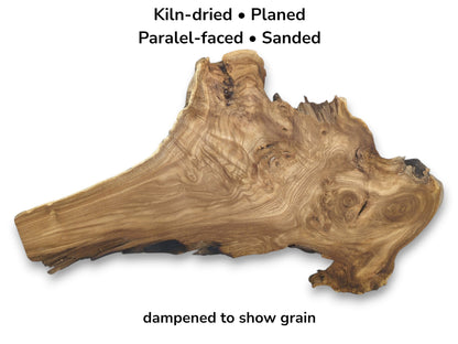 A planed hardwood blank, tapered on one end, reveals intricate swirling figuring and a gnarled edge.