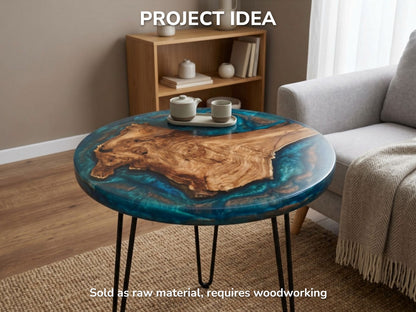 A live-edge burl slab with intricate grain is embedded in glossy, shimmering teal epoxy.