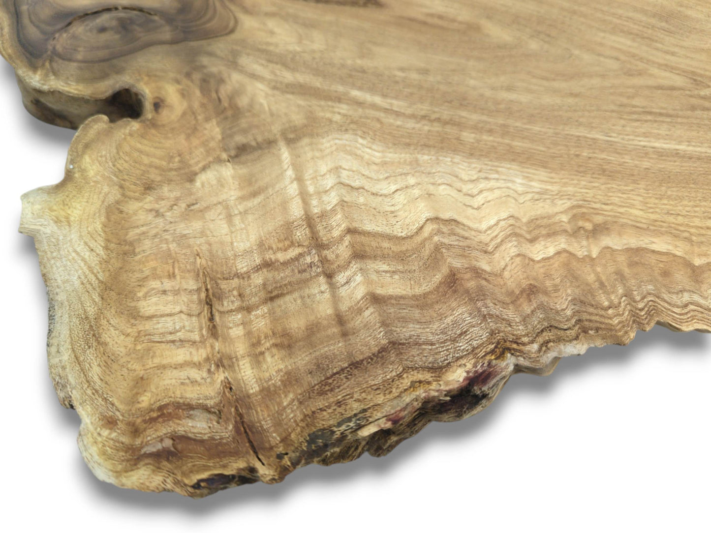 Undulating grain lines flow across a raw timber section with a dark, swirling knot.