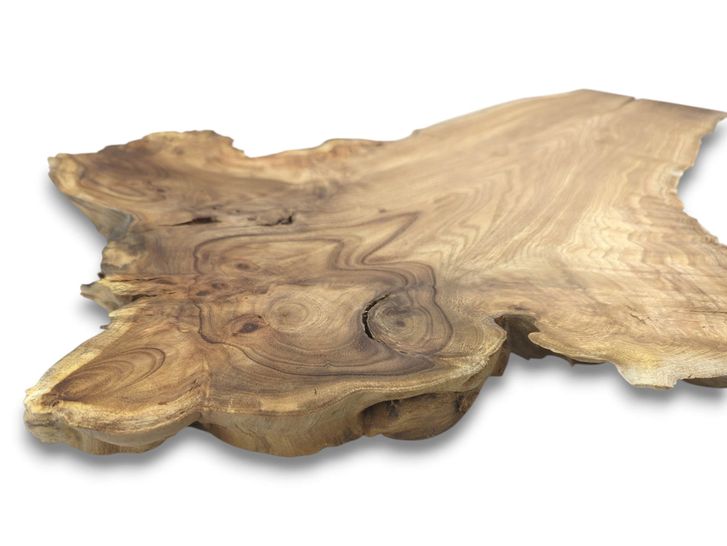 A thick lumber cross-section shows dark concentric grain rings surrounding a central natural fissure.