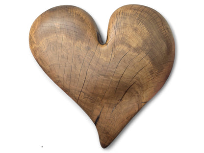 Sculpted brown hardwood heart with distinct wood grain, visible fissures, and a smooth oiled finish.