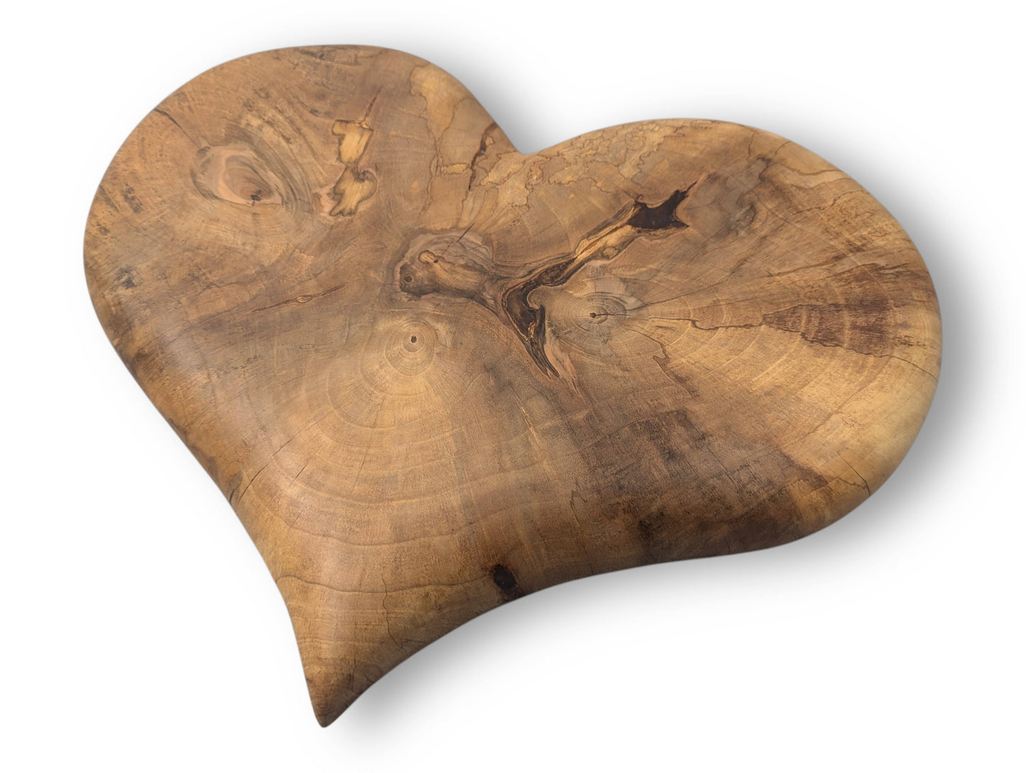 An irregularly shaped solid wood heart artwork features prominent natural grain, knots, cracks, and an oil finish.