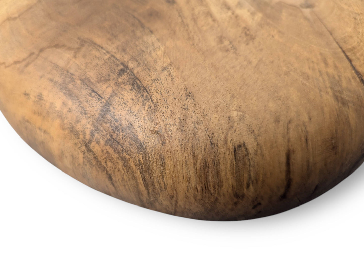 Close-up of a hand-carved solid wood surface, displaying prominent natural grain and dark oil finish.