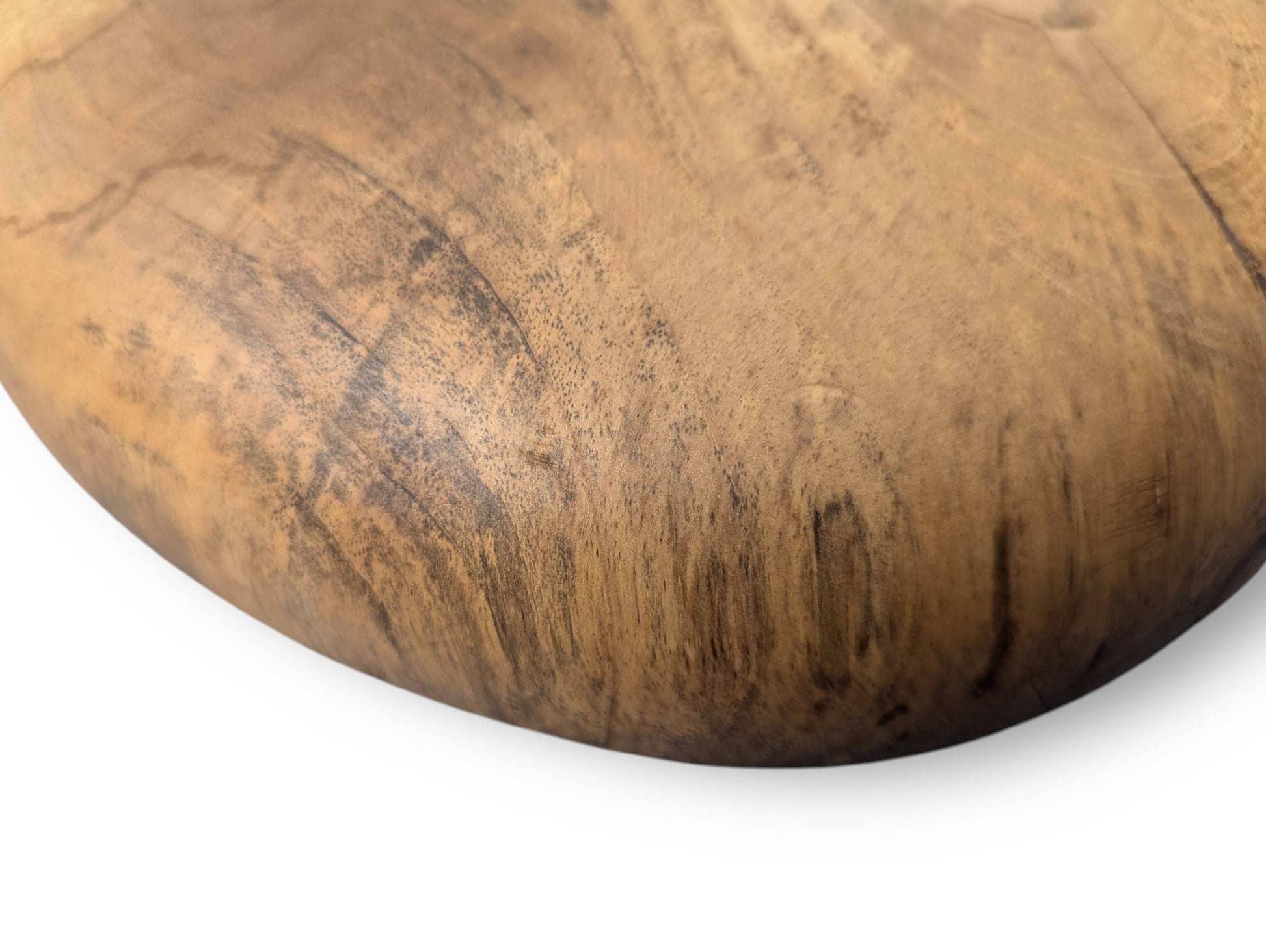 Close-up of a hand-carved solid wood surface, displaying prominent natural grain and dark oil finish.