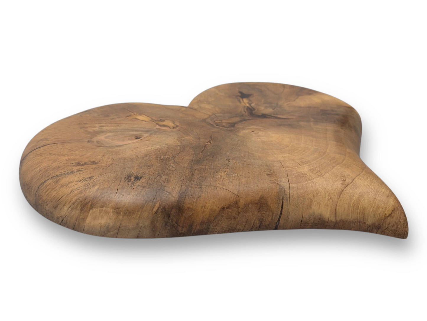 Wooden heart sculpture made of solid hardwood, showing natural grain, knots, cracks, and an oil finish.