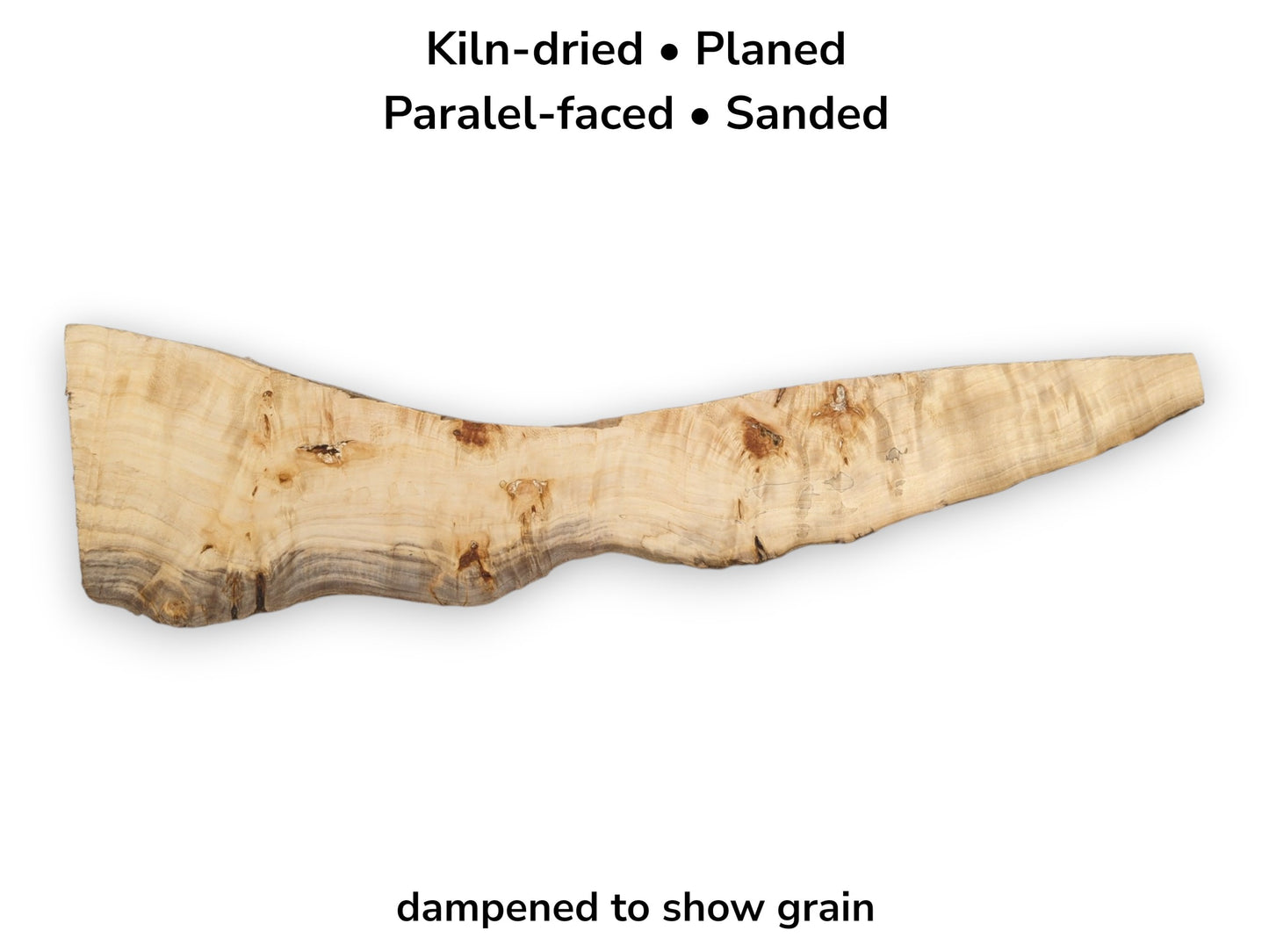 A long, light-toned poplar slab features a dark, undulating live edge and scattered knots.